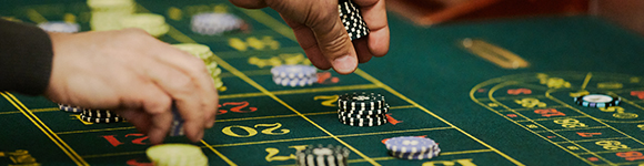 a player betting chips on roulette