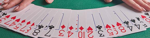 a deck of blackjack cards spread across a table