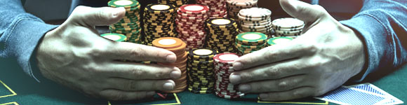 a casino player winning a huge amount of money in the form of baccarat chips