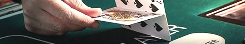 Player flipping cards at a casino