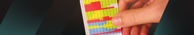 A person looking at a blackjack strategy chart